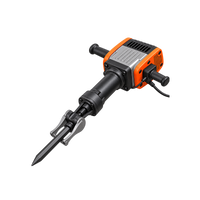 Alternate angled view of orange-and-black corded demolition hammer showing handle assembly, vented housing, and pointed chisel.