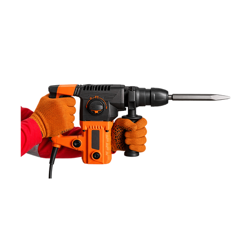 Orange-and-black corded chipping hammer held by gloved hands, with auxiliary grip and flat chisel pointing right.